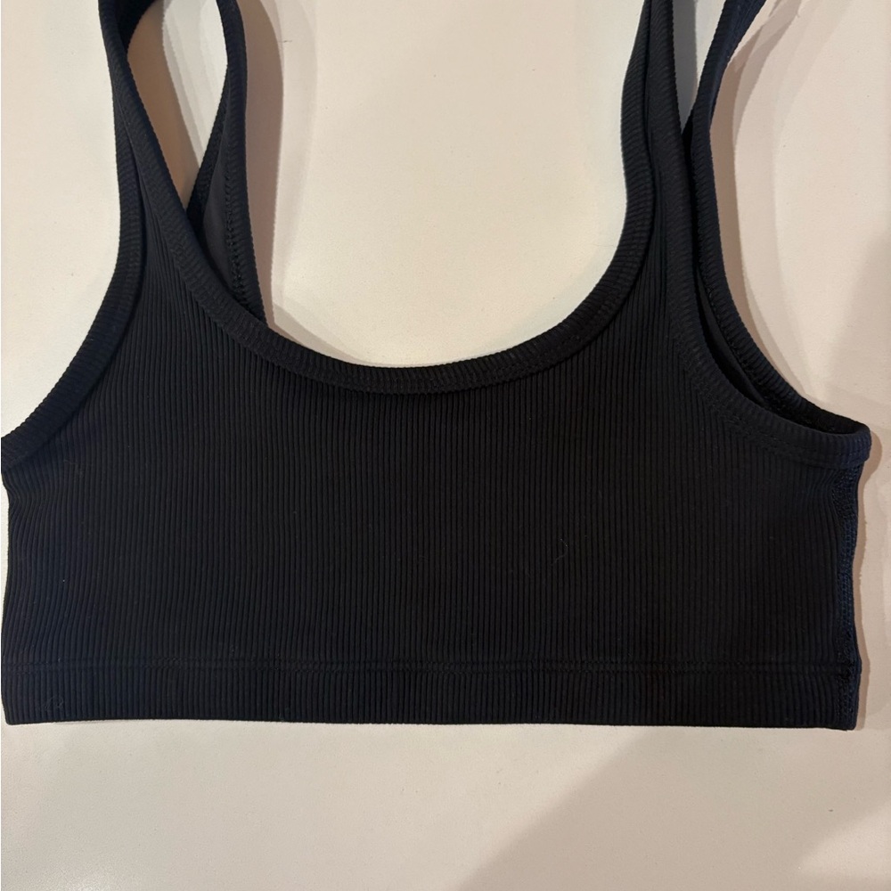 Aritzia TnAction Black Ribbed Bra Top Size XS 

In good preowned condition.